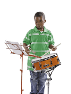 young boy playing the drums