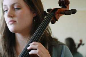 cello player practicing cello