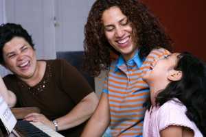 famiy enjoying music around a piano