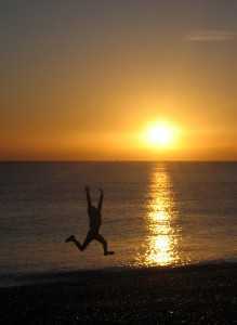 jumping person in sunset