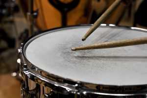 sticks on a snare drum