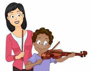 young boy receiving violin lesson