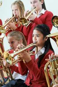 brass players in orchestra