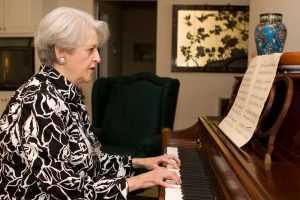 retired woman plays piano