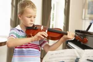 child practicing violin