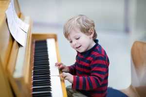 toddler playing piano