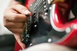 closeup of guitar player