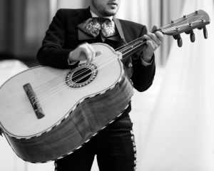 guitarron player in mariachi band