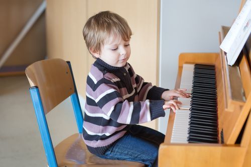 child playing piano