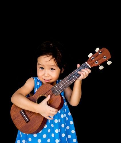 girl playing ukulele