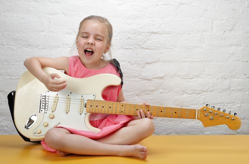 singing and playing guitar