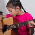 kid learning guitar